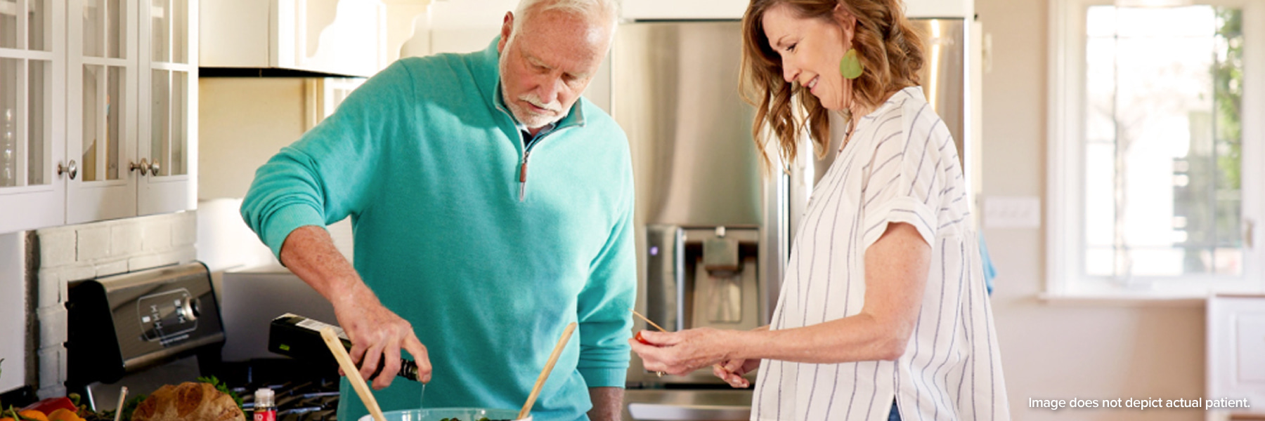 two people cooking together in a kitchen